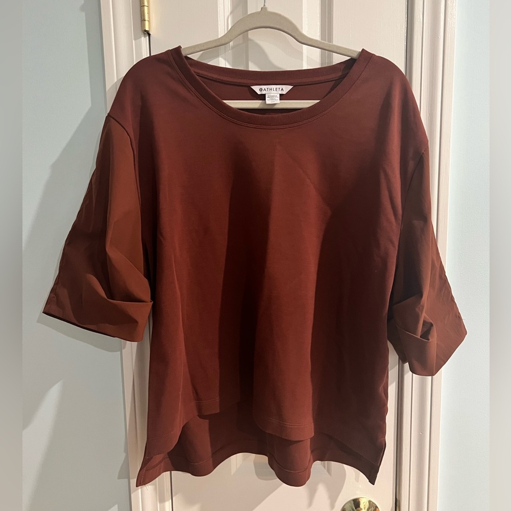 Rust Athleta top with asymmetric hem. Size XL. Mint condition.